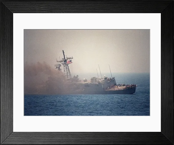 Framed Print : Guided missile frigate USS STARK listing to port after being struck by an Exocet missile launched from an Iraqi jet