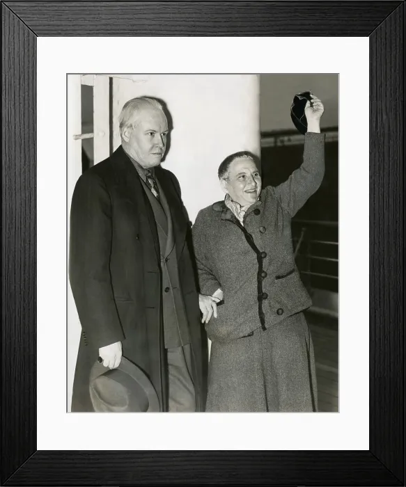 Framed Print : Photographer Carl Van Vechten with Gertrude Stein as she waves her hat from S.S. Champlain. May 4, 1935. Stein had been part of the expatriate art community is Paris for decades