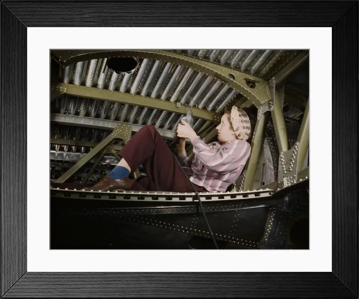 Framed Print : Woman war worker riveting an A-20 bomber. Douglas Aircraft Company plant, Long Beach, California, during World War 2, ca. 1942-45. (BSLOC_2013_14_120)