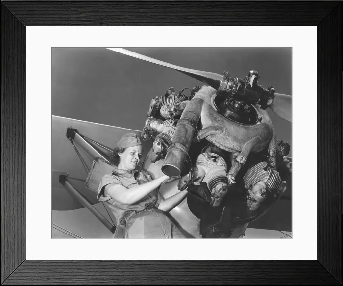 Framed Print : A young women soldier of Women's Army Corps (WAC) repairing aircraft during World War II. Ca. 1943-45. World War 2. (BSLOC_2013_14_109)