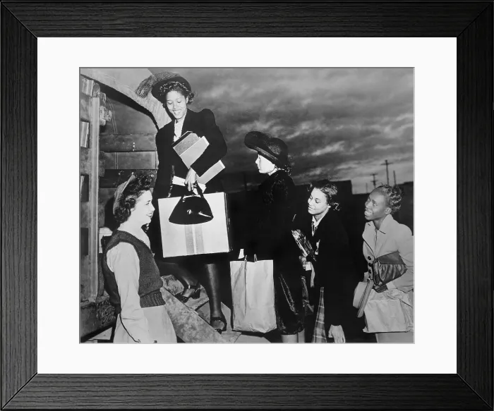 Framed Print : African American women recruits climbing into Army truck. They are beginning training in the Woman's Army Auxiliary Corps (WAAC). Ca. 1943-45. World War 2. (BSLOC_2013_14_111) Framed Print : African American women recruits climbing into Army truck. They are beginning training in the Woman's Army Auxiliary Corps (WAAC). Ca. 1943-45. World War 2. (BSLOC_2013_14_111)