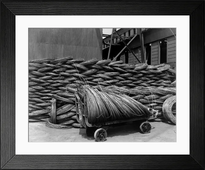 Framed Print : Wire rods, the raw material from which steel wire is drawn. Barbed wire was an essential defensive barricade used in the trench warfare in Europe. Pittsburgh Steel Co
