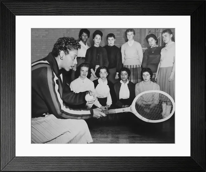 Framed Print : Althea Gibson, speaks to young women attending a tennis clinic at Midwood High in Brooklyn. Dec. 1957