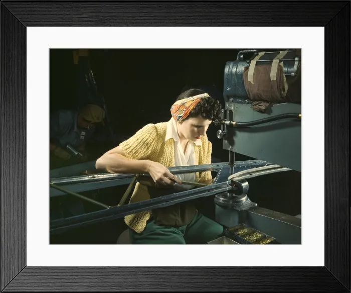 Framed Print : Woman operating a riveting machine on wing of B-17F heavy bombers during World War 2. Douglas Aircraft Company, Long Beach, California, Oct. 1942. (BSLOC_2013_14_144)