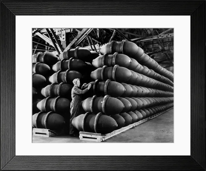 Framed Print : Woman war worker checks 1, 000 lb. bomb cases loaded with explosives. Firestone Tire and Rubber Co. Omaha, Nebraska. May 1943 during World War 2. (BSLOC_2013_14_146) Framed Print : Woman war worker checks 1, 000 lb. bomb cases loaded with explosives. Firestone Tire and Rubber Co. Omaha, Nebraska. May 1943 during World War 2. (BSLOC_2013_14_146)