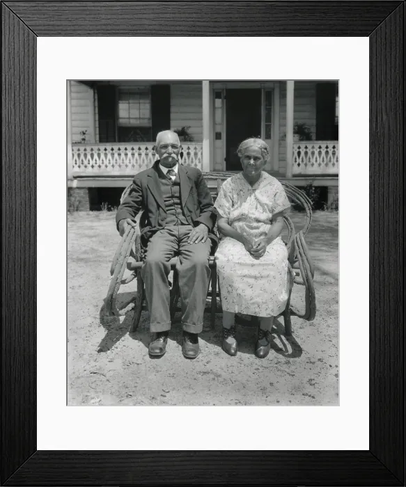 Framed Print : Prosperous African American farm couple, Nansemond, Virginia, May 1932. They are seated in front of a tidy house with unworn clothing. Photo by George Ackerman. (BSLOC_2013_8_125) Framed Print : Prosperous African American farm couple, Nansemond, Virginia, May 1932. They are seated in front of a tidy house with unworn clothing. Photo by George Ackerman. (BSLOC_2013_8_125)