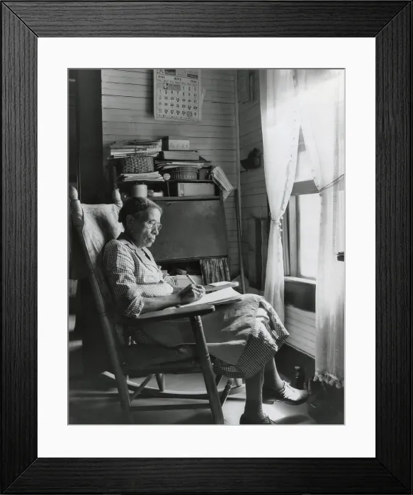 Framed Print : Elderly African American woman writing in a rocking chair, Putnam, Georgia, May 1941. (BSLOC_2013_8_126)