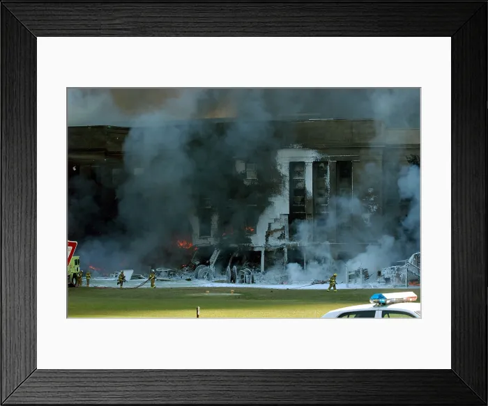 Framed Print : Firefighters work to put out the flames moments after a hijacked jetliner crashed into the Pentagon at approximately 9 30 AM on Sept