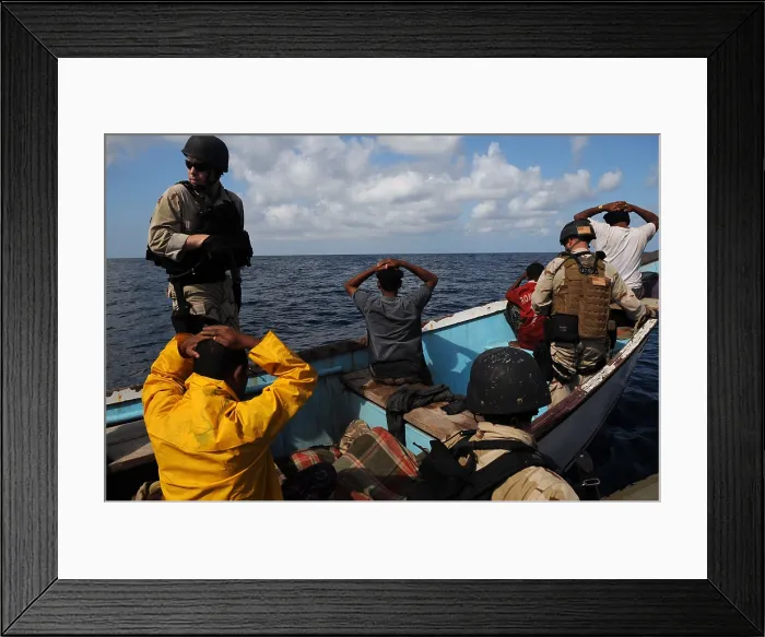 Framed Print : U.S. Navy and Coast Guard counter piracy personnel arrested the crew and seized and more than two tons of illegal narcotics on a drug-smuggling vessel in the Gulf of Aden Oct