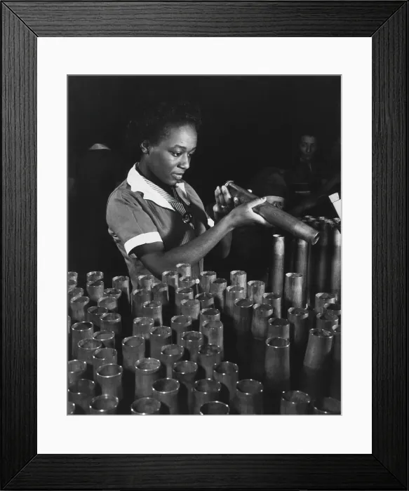 Framed Print : African American young woman inspecting the end of 40mm artillery cartridge case at Frankfort Arsenal. Bertha Stallworth, age 21, was a World War 2 munitions worker