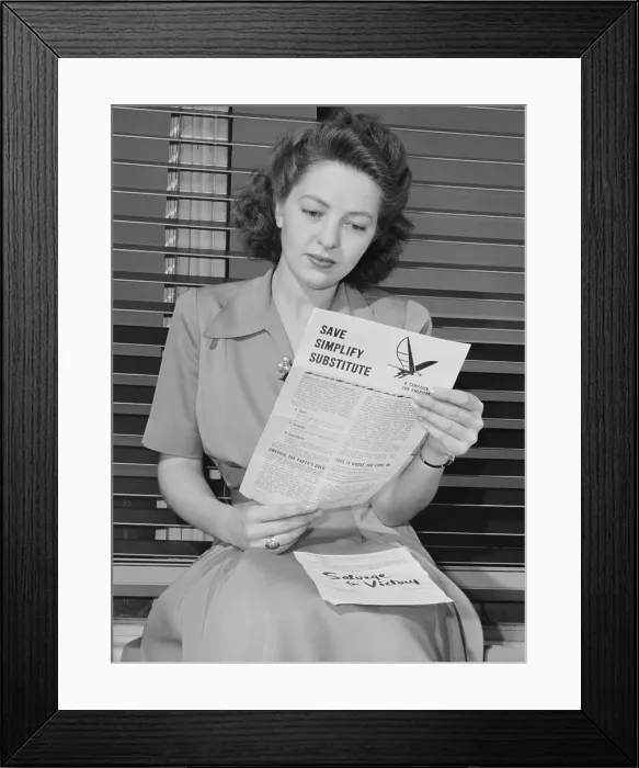 Framed Print : American woman reads a government brochure on titled Save, Simplify, Substitute Framed Print : American woman reads a government brochure on titled Save, Simplify, Substitute