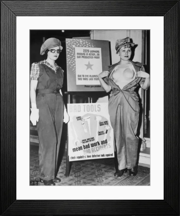 Framed Print : SAF-T-BRA for women war workers at Marinship Corporation. Underneath the uniform at left, is a protective plastic bra modeled on the right Framed Print : SAF-T-BRA for women war workers at Marinship Corporation. Underneath the uniform at left, is a protective plastic bra modeled on the right