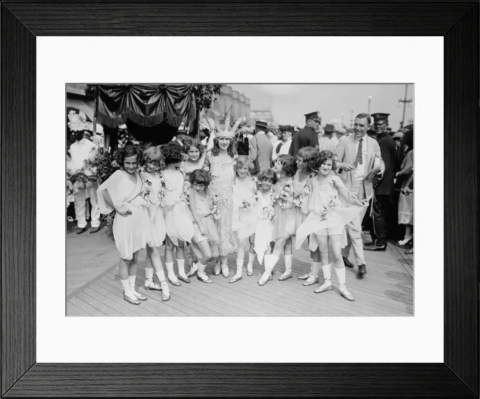 Framed Print : Margaret Gorman, the first Miss America of 1921. She is escorted by garlanded young girls on the crowded boardwalk in Atlantic City, N.J. (BSLOC_2015_17_207)