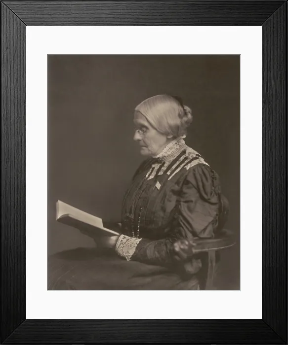Framed Print : Susan B. Anthony sitting and reading a book, ca. 1900. Born in 1820, she celebrated her eightieth birthday at the White House at the invitation of President William McKinley