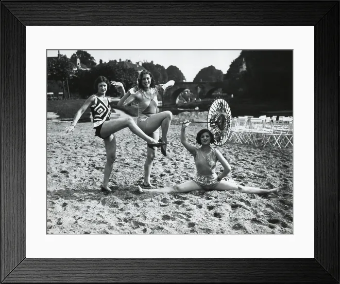 Framed Print : Acrobatic French women pose in the latest fashionable bathing suits on the sand beach at Dieppe. Ca. 1925. (BSLOC_2015_17_202)