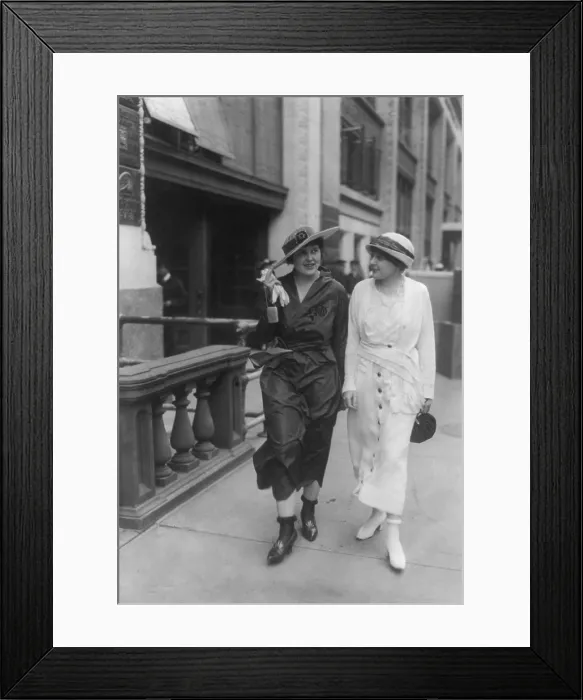 Framed Print : Two young women wearing their stockings rolled above their ankles, ca. 1922-24 Framed Print : Two young women wearing their stockings rolled above their ankles, ca. 1922-24