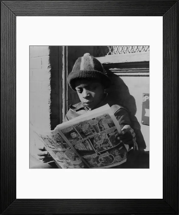 Framed Print : African American boy reading a comic book, on a door step, in the Southwest section, Washington, D.C. Nov. 1942. Photo by Gordon Parks. (BSLOC_2013_8_135)
