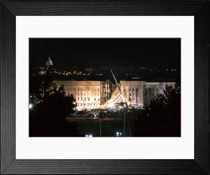 Framed Print : The huge 20 x 38 feet American flag is to the right of the damaged area of the Pentagon on the night of Sept. 12 2001 Framed Print : The huge 20 x 38 feet American flag is to the right of the damaged area of the Pentagon on the night of Sept. 12 2001