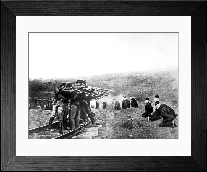 Framed Print : Austrian atrocities in Serbia. A long line of blindfolded and kneeling Serbian men near the Austrian lines were ruthlessly shot at a command