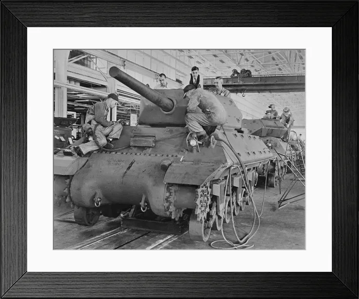 Framed Print : M-10 tanks in production on General Motors assembly line. American passenger cars were produced in very small numbers during World War 2. (BSLOC_2013_14_200)