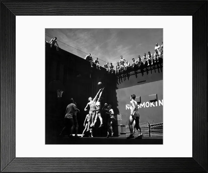 Framed Print : Navy pilots playing basketball in elevator well of USS MONTEREY during World War 2. Jumper at left is future U.S. President, Gerald R. Ford. Mid-1944 in the Pacific Ocean