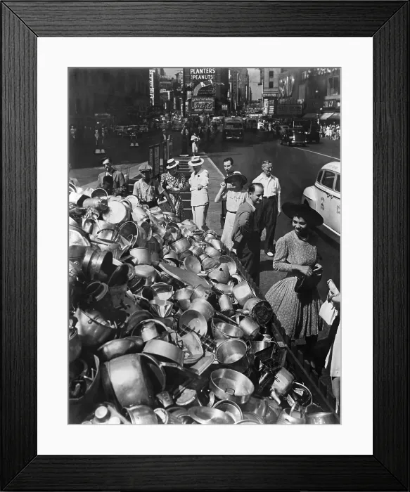 Framed Print : Collection point in New York City for aluminum during World War 2. Ca. 1942-45. African American and White pedestrians smile at the pots collected for the war effort Framed Print : Collection point in New York City for aluminum during World War 2. Ca. 1942-45. African American and White pedestrians smile at the pots collected for the war effort