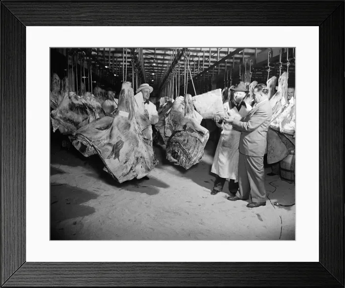 Framed Print : American wholesale meat market during World War 2. The meat bears government inspection stamps
