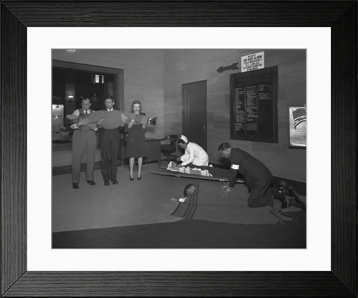 Framed Print : Air raid drill in Washington, D.C. during World War 2. Civil Defense volunteers train in treating the injured. Ca. 1941-45. (BSLOC_2013_14_192) Framed Print : Air raid drill in Washington, D.C. during World War 2. Civil Defense volunteers train in treating the injured. Ca. 1941-45. (BSLOC_2013_14_192)