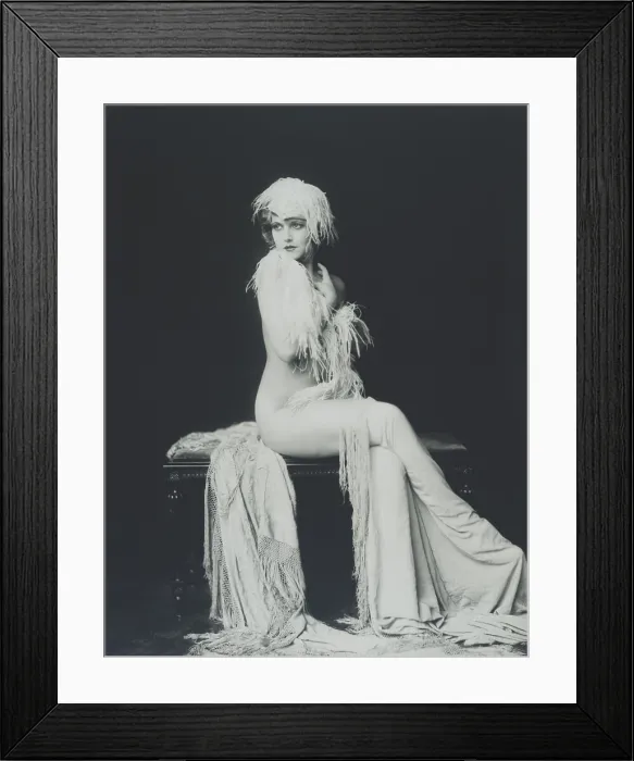 Framed Print : Actress and Ziegfeld girl Claudia Dell. Full length portrait of Dell nude and draped in feathers and cloth Framed Print : Actress and Ziegfeld girl Claudia Dell. Full length portrait of Dell nude and draped in feathers and cloth