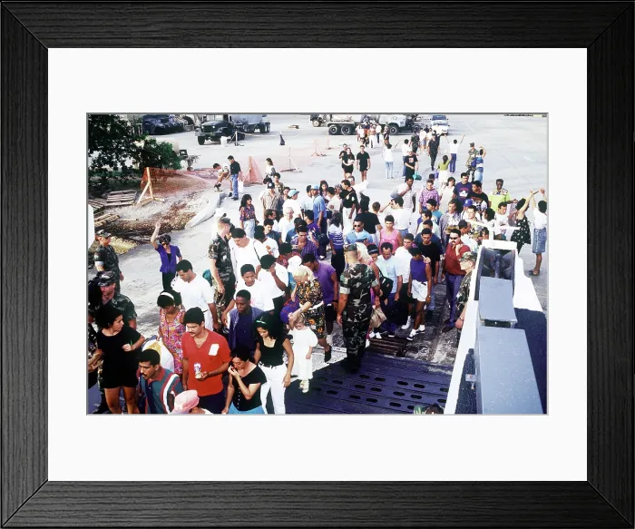 Framed Print : Cuban migrants at Guantanamo Bay Naval Base assembling for their flight to Homestead Air Force Base Florida where they will be admitted to the U.S