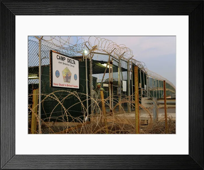 Framed Print : U.S. Soldiers guard a controlled entryway at Camp Delta the Guantanamo Bay military prison at the Naval Base in eastern Cuba