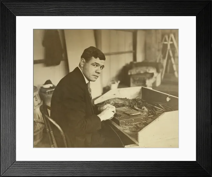Framed Print : Babe Ruth rolling a Babe Ruth Cigar for his new business venture. Oct. 30, 1919. (BSLOC_2015_17_27)