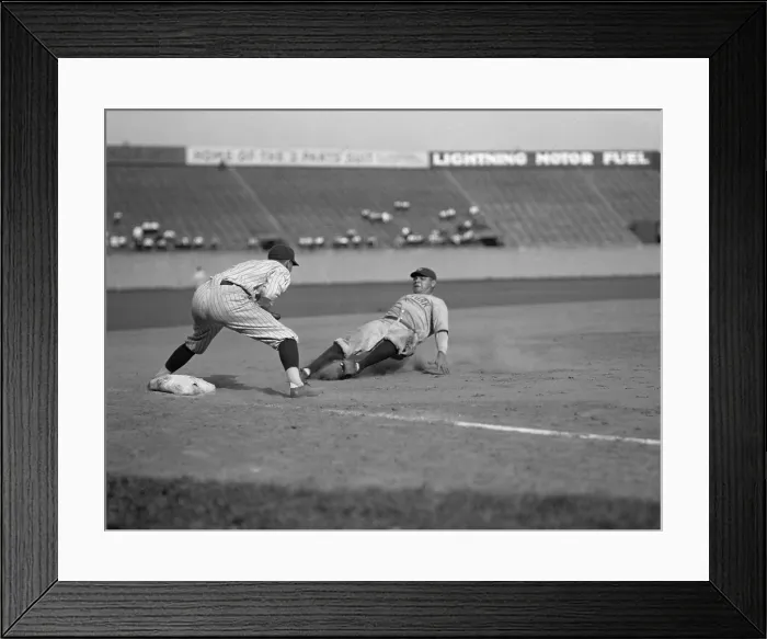 Framed Print : Babe Ruth slides in safe at third base on Bob Meusel's fly out. Senators third baseman is Ossie Bluege. 1925. (BSLOC_2015_17_29)