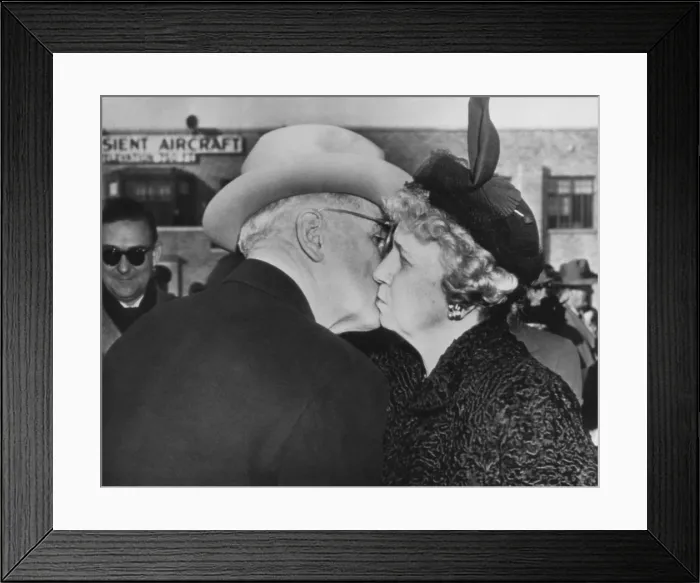 Framed Print : President Truman kisses his wife goodbye before boarding the plane for Washington. Mrs