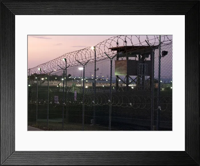 Framed Print : Guard tower at dawn at Camp Delta the military prison at Naval Base Guantanamo Bay Cuba. June 9 2010. Photo by:Everett Collection(BSLOC_2011_6_159)