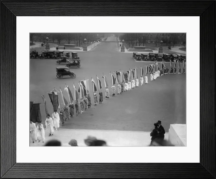 Framed Print : Woman Suffrage demonstration with banners at the U.S. Capitol in 1917. View of the procession from the Capitol steps