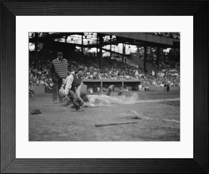 Framed Print : Yankees Lou Gehrig scores as Joe Harris throw gets away from catcher Hank Severeid of Senators. New York Yankees beat Washington, Senators 3-2. Aug. 16, 1925