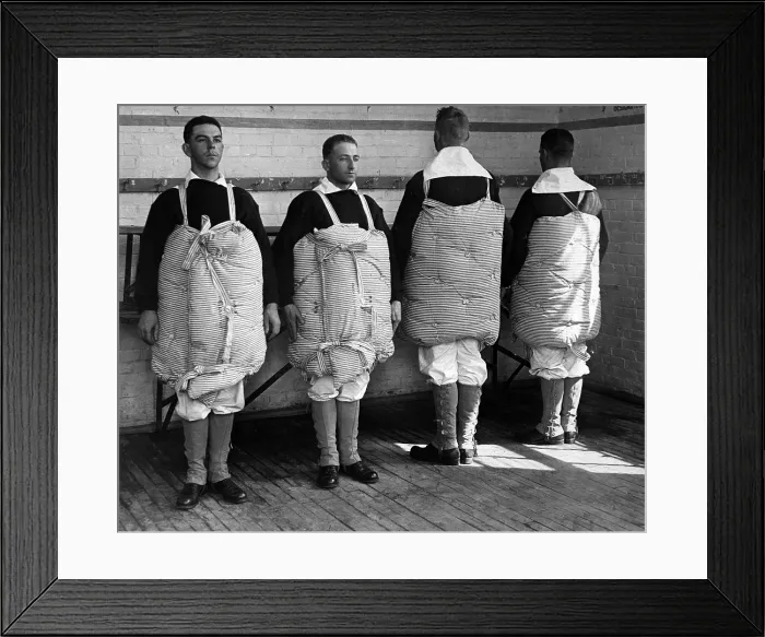 Framed Print : Navy recruits with their mattresses tied to them to serve as life preservers. Newport Naval Training Station, Rhode Island. World War I. April 1917 Framed Print : Navy recruits with their mattresses tied to them to serve as life preservers. Newport Naval Training Station, Rhode Island. World War I. April 1917