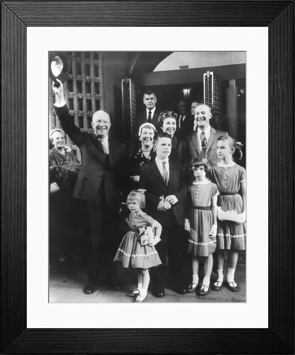 Framed Print : President and Mamie Eisenhower with their son John, his wife Barbara and four children leaving church. Ca. 1958