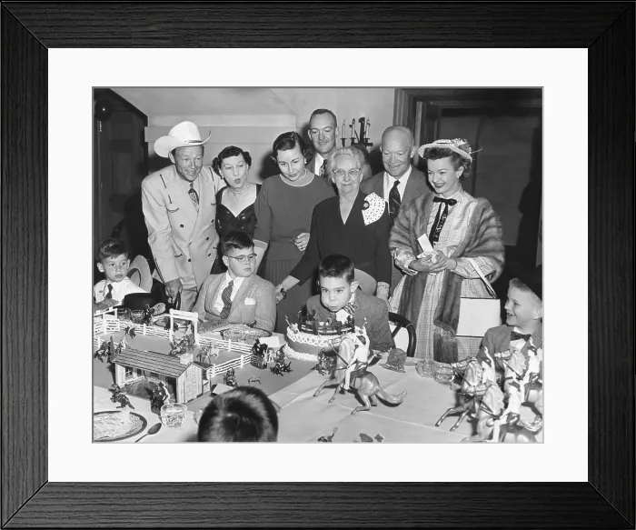 Framed Print : David Eisenhower blows out the candles on his birthday cake. March 31, 1956. Attending his White House birthday party are actors Roy Rogers and Dale Evans and 25 children Framed Print : David Eisenhower blows out the candles on his birthday cake. March 31, 1956. Attending his White House birthday party are actors Roy Rogers and Dale Evans and 25 children