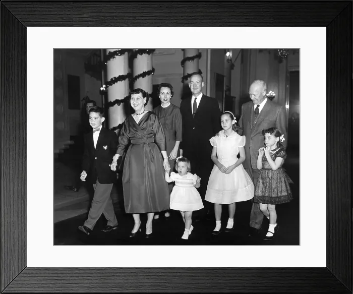 Framed Print : Eisenhower family Christmas at the White House. L-R: David, the First Lady, Barbara, Mary Jean, John, Barbara Ann, the President, and Susan. Ca. 1958. - (BSLOC_2014_16_112)