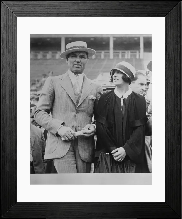 Framed Print : Jack Dempsey and wife, actress Estelle Taylor, at a sports event. They co-starred in a Broadway play called THE BIG FIGHT 1928. (BSLOC_2015_17_75)