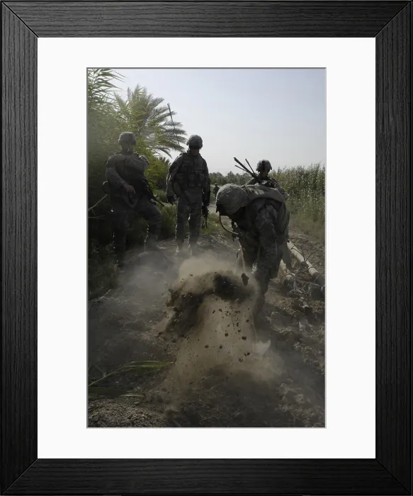 Framed Print : US Army Soldiers search for buried weapons at a remote village outside of Lutafiyah located in the southern sector of the city of Baghdad Iraq. July 5 2007. (BSLOC_2011_12_155)