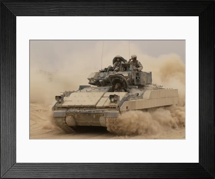 Framed Print : An Army Bradley Fighting Vehicle kicks up dust as it leaves for a mission from Forward Operating Base MacKenzie in Iraq. Oct. 30 2004. (BSLOC_2011_12_161)