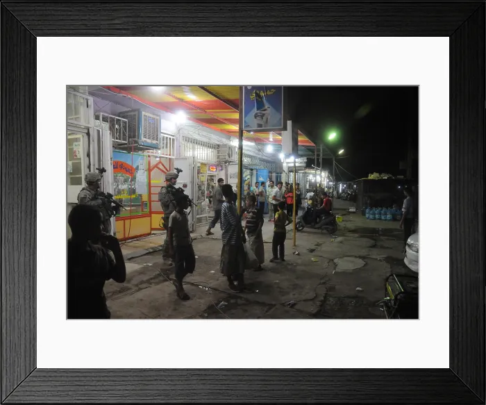 Framed Print : US soldiers on a busy night in the Al-Beidh'a district of Baghdad. Aug. 27 2008. (BSLOC_2011_12_163) Framed Print : US soldiers on a busy night in the Al-Beidh'a district of Baghdad. Aug. 27 2008. (BSLOC_2011_12_163)