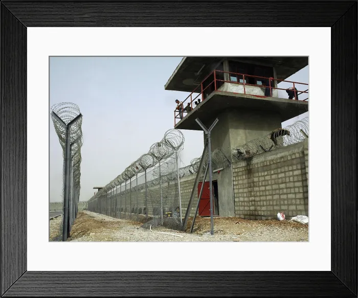 Framed Print : Nasiriyah Prison under construction during the US and Coalition occupation of Iraq. The maximum security prison will hold up to 800 inmates. Aug. 14 2005. (BSLOC_2011_12_164)