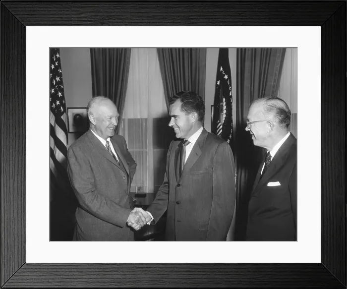Framed Print : President Eisenhower shaking Richard Nixon's hand on his return from the USSR. He was accompanied by the President's brother, Milton (right). Aug. 5, 1959