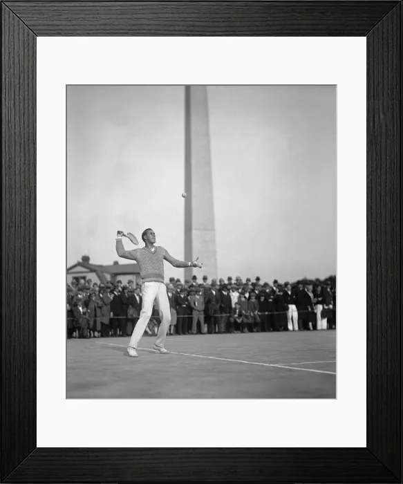 Framed Print : Bill Tilden, tennis champion serving on the Municipal Courts, Washington, D.C. May 6, 1926. Spectators watch from the sidelines with the Washington Monument in the background Framed Print : Bill Tilden, tennis champion serving on the Municipal Courts, Washington, D.C. May 6, 1926. Spectators watch from the sidelines with the Washington Monument in the background