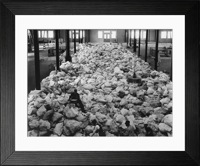Framed Print : Christmas mail for American World War I soldiers being sorted at Pier 86, in New York City. The mail comes from every part of the country. Nov. 20, 1918