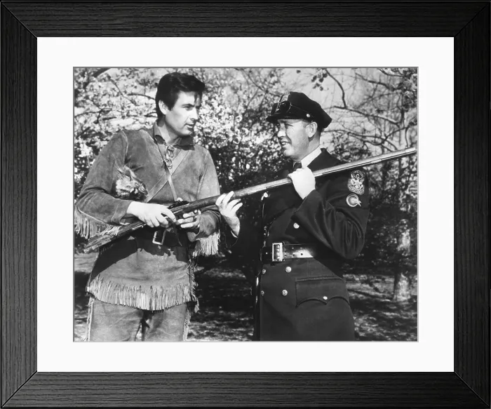 Framed Print : Actor Fess Parker in the frontier costume of Davy Crocket with a White House policeman Framed Print : Actor Fess Parker in the frontier costume of Davy Crocket with a White House policeman